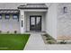 Inviting front entrance with double doors, a walkway, manicured landscaping, and modern house numbers at 26655 S 169Th Pl, Queen Creek, AZ 85142