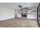 Spacious living room features a brick fireplace, floating shelves, and sliding glass doors at 26655 S 169Th Pl, Queen Creek, AZ 85142