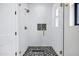 Modern tiled shower with glass doors and gold fixtures, offering a luxurious bathing experience at 26655 S 169Th Pl, Queen Creek, AZ 85142