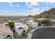 Scenic aerial view of a charming home with a lush, landscaped yard in a private community at 27 W Cochise Dr, Phoenix, AZ 85021