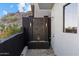 Balcony showcasing a stacked stone water feature, custom lighting, and city views at 27 W Cochise Dr, Phoenix, AZ 85021