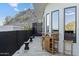 Balcony with a wet bar, mountain views, textured wall and privacy fence at 27 W Cochise Dr, Phoenix, AZ 85021