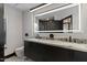 Bathroom with marble countertops, double sinks, and modern fixtures at 27 W Cochise Dr, Phoenix, AZ 85021