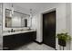 Elegant bathroom featuring a double vanity, granite countertops, and modern fixtures, creating a stylish and functional space at 27 W Cochise Dr, Phoenix, AZ 85021