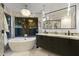 Luxurious bathroom with a soaking tub, marble countertops, and elegant fixtures, offering a serene escape at 27 W Cochise Dr, Phoenix, AZ 85021