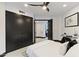 Bedroom with large wardrobe, neutral decor and sleek lighting fixtures at 27 W Cochise Dr, Phoenix, AZ 85021