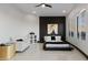Bedroom with stylish black accent wall, shuttered windows, and modern decor at 27 W Cochise Dr, Phoenix, AZ 85021