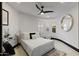 Bedroom with a sleek, modern design, large windows, and a comfortable bed at 27 W Cochise Dr, Phoenix, AZ 85021