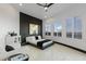 Bedroom with stylish black accent wall, shuttered windows, and modern decor at 27 W Cochise Dr, Phoenix, AZ 85021