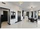 Open-concept living space features modern appliances, dining, and views into the Living Room at 27 W Cochise Dr, Phoenix, AZ 85021
