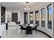 Dining room features modern lighting, views to the outside, and seating for four at 27 W Cochise Dr, Phoenix, AZ 85021