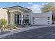 Beautiful home featuring a stylish entryway, multi-car garage, and neatly maintained front yard at 27 W Cochise Dr, Phoenix, AZ 85021
