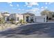 Charming home with manicured landscaping, a multi-car garage, and a welcoming entryway at 27 W Cochise Dr, Phoenix, AZ 85021