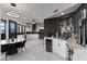 Modern kitchen with sleek cabinetry, wine storage and modern lighting fixtures at 27 W Cochise Dr, Phoenix, AZ 85021