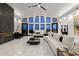 Bright, spacious living room with expansive windows, modern fireplace, and stylish decor at 27 W Cochise Dr, Phoenix, AZ 85021