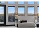 Bright living room with floor-to-ceiling windows showcasing city and mountain views at 27 W Cochise Dr, Phoenix, AZ 85021