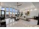 Bright, expansive living room with vaulted ceilings, sleek flooring, and views of the city at 27 W Cochise Dr, Phoenix, AZ 85021