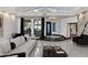 Open-concept living room with modern decor, tile flooring, and great natural light at 27 W Cochise Dr, Phoenix, AZ 85021