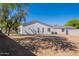 View of the home's exterior with a well-maintained yard, showcasing a private and serene outdoor space at 2991 E Folley Pl, Chandler, AZ 85225