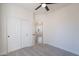 Bedroom with sliding door closet, gray carpet, and doorway leading to bathroom at 2991 E Folley Pl, Chandler, AZ 85225