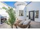 Charming courtyard with fireplace, outdoor seating, white walls, and turret architectural element at 2991 E Folley Pl, Chandler, AZ 85225