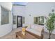 Cozy outdoor courtyard with comfortable seating, neutral color scheme, and privacy at 2991 E Folley Pl, Chandler, AZ 85225