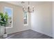 Bright dining room with wood-look flooring and plenty of natural light at 2991 E Folley Pl, Chandler, AZ 85225
