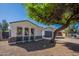 View of the side of the home showing the 3 windows, the yard and the two car garage at 2991 E Folley Pl, Chandler, AZ 85225