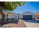 Charming single-story home with a well-maintained front yard and a two-car garage at 2991 E Folley Pl, Chandler, AZ 85225