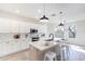 Modern kitchen with white cabinets, stainless steel appliances, and a large island with seating at 2991 E Folley Pl, Chandler, AZ 85225