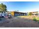 Large backyard features a covered patio, storage shed, and swing set, perfect for outdoor living at 3021 E Larkspur Dr, Phoenix, AZ 85032