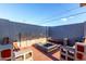 Backyard features a fire pit with seating and a cinder block perimeter fence for privacy at 3021 E Larkspur Dr, Phoenix, AZ 85032