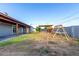 Spacious backyard with a patio, room for activities, and block wall surround at 3021 E Larkspur Dr, Phoenix, AZ 85032