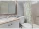 Bathroom featuring a single sink vanity, toilet, and shower/tub combo at 3021 E Larkspur Dr, Phoenix, AZ 85032