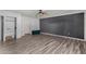 Bright bedroom with stylish flooring, a modern accent wall, and closet space at 3021 E Larkspur Dr, Phoenix, AZ 85032