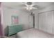 Neutral bedroom featuring ample closet space and tiled flooring at 3021 E Larkspur Dr, Phoenix, AZ 85032