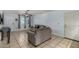 Bright living room featuring tile floors, a ceiling fan, and a comfortable sofa at 3021 E Larkspur Dr, Phoenix, AZ 85032