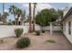 Spacious xeriscaped backyard featuring desert landscaping, a privacy fence, and covered patio at 3022 E Emile Zola Ave, Phoenix, AZ 85032