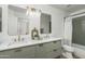 Bright bathroom featuring a double sink vanity with updated fixtures and a shower with a tiled surround at 3022 E Emile Zola Ave, Phoenix, AZ 85032