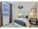 Inviting bedroom with neutral decor, stylish lighting, and a comfortable bed, perfect for a cozy retreat at 3141 S 155Th Ln, Goodyear, AZ 85338