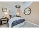 Charming bedroom with neutral tones, a designer mirror, and comfortable bedding, offering a tranquil ambiance at 3141 S 155Th Ln, Goodyear, AZ 85338