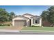Charming single-story home with a brick driveway, two-car garage, and well-maintained landscaping at 3141 S 155Th Ln, Goodyear, AZ 85338