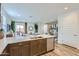 Bright, airy kitchen with stainless appliances and an island that offers views into the living and dining areas at 3141 S 155Th Ln, Goodyear, AZ 85338