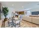 Open-concept living room seamlessly connects to the dining area and kitchen, ideal for entertaining at 3141 S 155Th Ln, Goodyear, AZ 85338