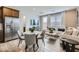 Open concept living area featuring a kitchen, dining space, and comfortable seating, perfect for entertaining at 3141 S 155Th Ln, Goodyear, AZ 85338