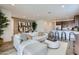 Spacious living room connects to the kitchen and dining area with stylish decor and a welcoming atmosphere at 3141 S 155Th Ln, Goodyear, AZ 85338