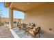 Cozy covered patio with comfortable seating, perfect for outdoor relaxation and enjoying the fresh air at 3141 S 155Th Ln, Goodyear, AZ 85338
