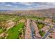 Stunning aerial view of a golf course community with mountain views and lush landscaping at 3252 E Maldonado Dr, Phoenix, AZ 85042