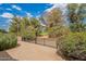 Backyard featuring a black metal fence and lush greenery, overlooking the community golf course at 3252 E Maldonado Dr, Phoenix, AZ 85042