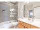 Modern bathroom featuring tiled shower with glass door, a vanity and updated fixtures at 3252 E Maldonado Dr, Phoenix, AZ 85042